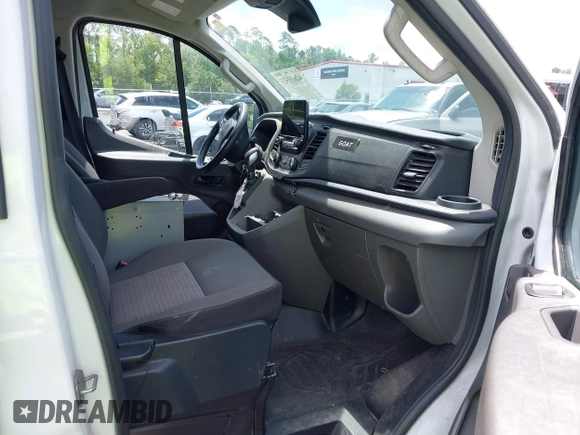 2020 Ford Transit Cargo with VIN 1FTBR1Y8XLKA19646, listed as a IAAI auction lot 42633323 with 82,577 mi miles and . Bid and sale history available at DreamBid. Image 5.