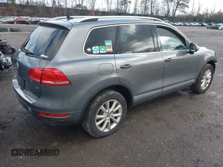 2013 Volkswagen Touareg Lux with VIN WVGEF9BPXDD000679, listed as a IAAI auction lot 41956471 with 117,465 mi miles and . Bid and sale history available at DreamBid. Image 4.