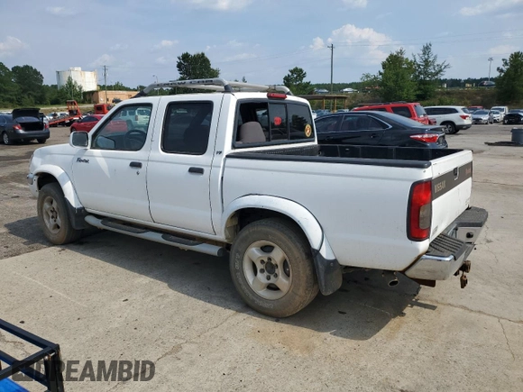 2000 Nissan Frontier XE with VIN 1N6ED27T1YC385792, listed as a Copart auction lot 62268225 with 291,906 mi miles and Salvage title. Bid and sale history available at DreamBid. Image 2.