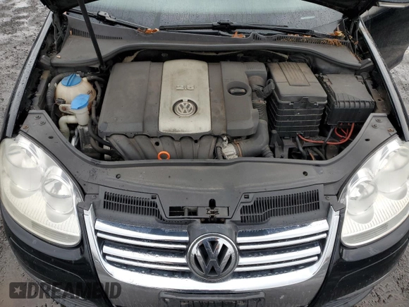 2009 Volkswagen Jetta z VIN 3VWKZ71K09M250143, wystawiony jako Copart lot #82247774 z przebiegiem 156 600 mil mil oraz Szkoda całkowita • Salvage title. Historia ofert i sprzedaży dostępna na DreamBid. Obrazek 11.