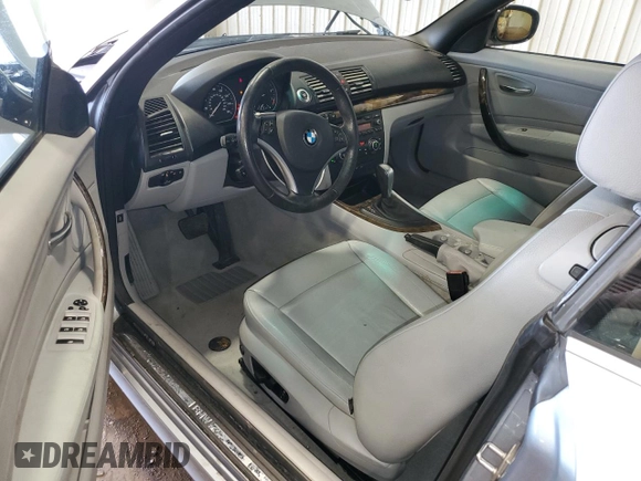 2011 BMW 1 Series 128i with VIN WBAUL7C57BVM80274, listed as a Copart auction lot 52127595 with 104,952 mi miles and Salvage title. Bid and sale history available at DreamBid. Image 8.