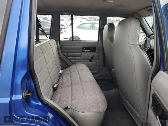 1995 Jeep Cherokee SE with VIN 1J4FJ28S9SL667332, listed as a Copart auction lot 81849264 with 201,205 mi miles and Salvage Title. Bid and sale history available at carsss.com. Image 10.