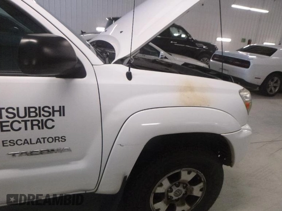 2013 Toyota Tacoma with VIN 3TMMU4FN6DM062201, listed as a IAAI auction lot 42906789 with 266,431 mi miles and . Bid and sale history available at DreamBid. Image 3.
