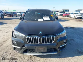 2018 BMW X1 sDrive28i with VIN WBXHU7C37J5H43318, listed as a IAAI auction lot 41294730 with 73,600 mi miles. Bid and sale history available at carsss.com. Image 12.