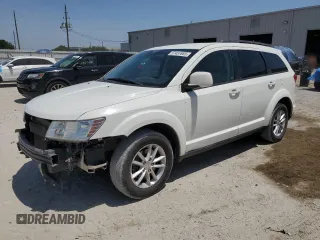 2015 Dodge Journey SXT with VIN 3C4PDCBG6FT701801, listed as a Copart auction lot 57457885 with 183,329 mi miles and Salvage title. Bid and sale history available at DreamBid. Image 1.