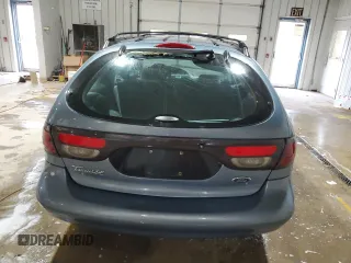 1999 Ford Taurus SE z VIN 1FAFP58S0XG301691, wystawiony jako Copart lot #81920424 z przebiegiem 203 931 mil mil oraz Szkoda całkowita • Salvage title. Historia ofert i sprzedaży dostępna na DreamBid. Obrazek 6.
