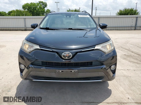 2018 Toyota RAV4 XLE with VIN 2T3WFREV2JW433186, listed as a Copart auction lot 61008705 with 57,310 mi miles and Salvage title. Bid and sale history available at DreamBid. Image 5.