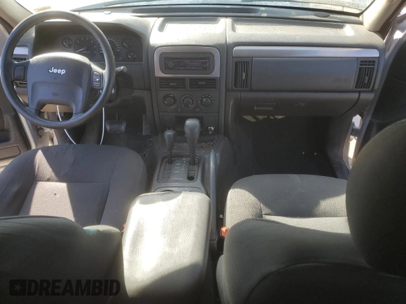 2004 Jeep Grand Cherokee Laredo with VIN 1J4GW48S54C349888, listed as a Copart auction lot 43009574 with 238,247 mi miles and Salvage title. Bid and sale history available at DreamBid. Image 8.