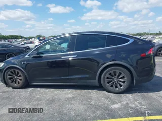 2017 Tesla Model X 90D with VIN 5YJXCBE21HF054898, listed as a IAAI auction lot 42076462 with 89,996 mi miles and . Bid and sale history available at DreamBid. Image 13.