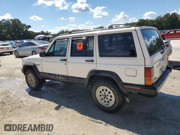 1996 Jeep Cherokee Sport with VIN 1J4FT68S4TL131956, listed as a Copart auction lot 74568064 with 174,014 mi miles and Non Repairable. Bid and sale history available at carsss.com. Image 2.