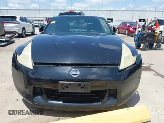 2012 Nissan 370Z z VIN JN1AZ4EH1CM564630, wystawiony jako IAAI lot #42177880 z przebiegiem 173 751 mil mil oraz . Historia ofert i sprzedaży dostępna na DreamBid. Obrazek 13.