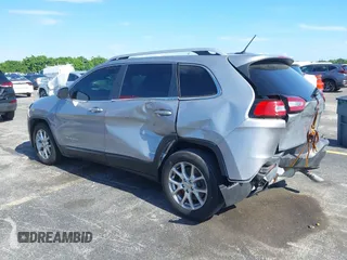 2014 Jeep Cherokee Latitude with VIN 1C4PJLCS6EW103423, listed as a IAAI auction lot 40118289 with 112,120 mi miles and . Bid and sale history available at DreamBid. Image 3.