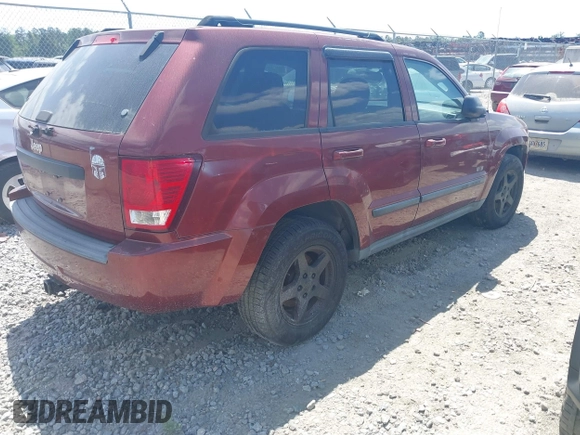 2007 Jeep Grand Cherokee Laredo with VIN 1J8GR48K57C618529, listed as a IAAI auction lot 42139566 with 174,559 mi miles. Bid and sale history available at carsss.com. Image 4.
