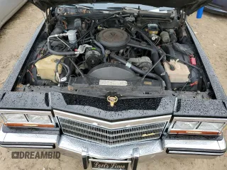 1986 Cadillac Fleetwood z VIN 1G6DW69YXG9739705, wystawiony jako Copart lot #74947294 z przebiegiem 53 213 mil mil oraz Nie do naprawy. Historia ofert i sprzedaży dostępna na DreamBid. Obrazek 11.