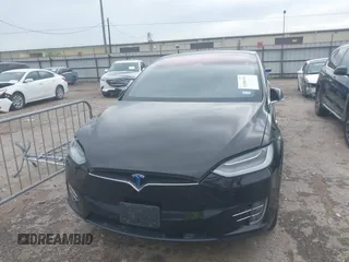 2021 Tesla Model X Long Range Plus with VIN 5YJXCAE27MF324270, listed as a IAAI auction lot 41886101 with 59,614 mi miles and . Bid and sale history available at carsss.com. Image 6.