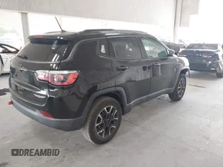 2020 Jeep Compass Trailhawk with VIN 3C4NJDDB3LT170463, listed as a IAAI auction lot 42446080 with 83,336 mi miles and . Bid and sale history available at DreamBid. Image 4.
