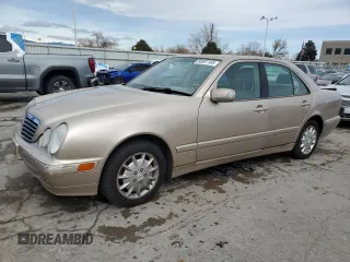 2000 Mercedes-Benz E-Class with VIN WDBJF82J0YX040071, listed as a Copart auction lot 50001165 with 145,638 mi miles and Salvage Title. Bid and sale history available at carsss.com. Image 1.