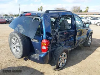 2004 Jeep Liberty Limited with VIN 1J4GK58KX4W110899, listed as a IAAI auction lot 41544199 with 242,501 mi miles. Bid and sale history available at carsss.com. Image 4.