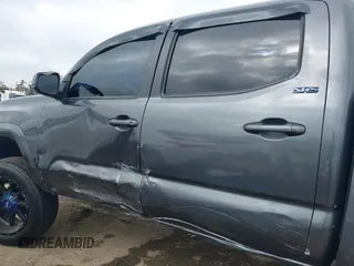 2018 Toyota Tacoma SR5 with VIN 5TFAZ5CNXJX066952, listed as a IAAI auction lot 41894562 with 141,818 mi miles and . Bid and sale history available at DreamBid. Image 6.