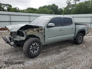 2023 Toyota Tacoma SR with VIN 3TMCZ5AN7PM552886, listed as a Copart auction lot 57447135 with 66,634 mi miles and Salvage title. Bid and sale history available at DreamBid. Image 1.