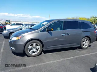 2013 Honda Odyssey Touring with VIN 5FNRL5H95DB045666, listed as a IAAI auction lot 42117219 with 50,715 mi miles and . Bid and sale history available at carsss.com. Image 14.