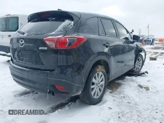 2014 Mazda CX-5 Touring with VIN JM3KE4CY8E0416590, listed as a IAAI auction lot 41619713 with 225,156 mi miles. Bid and sale history available at carsss.com. Image 4.