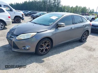 2013 Ford Focus SE with VIN 1FADP3F28DL233822, listed as a IAAI auction lot 42583041 with 135,728 mi miles and . Bid and sale history available at DreamBid. Image 2.