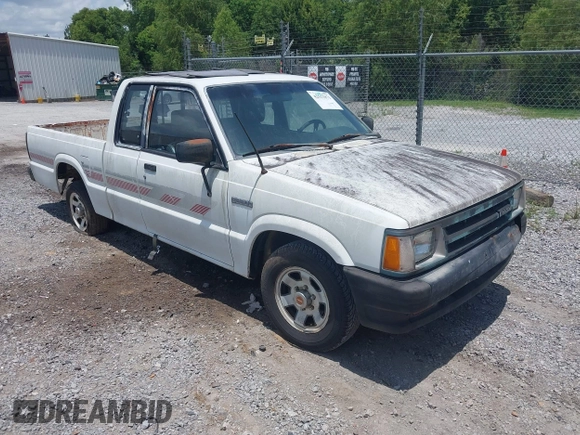 1991 Mazda B-Series Truck z VIN JM2UF3133M0169084, wystawiony jako IAAI lot #42511871 z przebiegiem 175 426 mil mil oraz . Historia ofert i sprzedaży dostępna na DreamBid. Obrazek 1.
