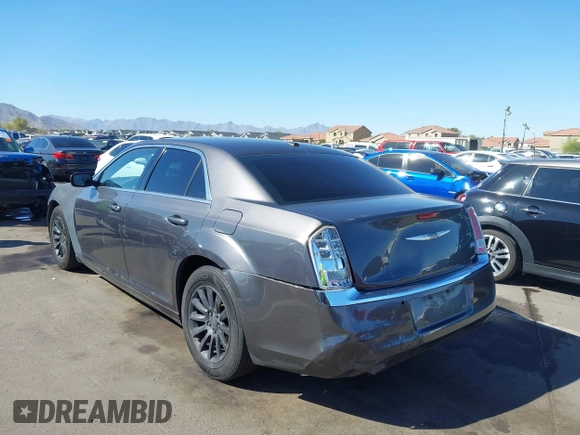 2014 Chrysler 300 with VIN 2C3CCAAG1EH191375, listed as a IAAI auction lot 41867688 with 218,740 mi miles. Bid and sale history available at carsss.com. Image 3.