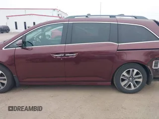 2014 Honda Odyssey Touring with VIN 5FNRL5H97EB117971, listed as a IAAI auction lot 41794324 with 198,191 mi miles and . Bid and sale history available at DreamBid. Image 14.