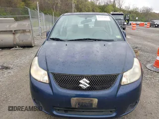 2011 Suzuki SX4 LE with VIN JS2YC5A23B6304713, listed as a IAAI auction lot 41997287 with 114,024 mi miles. Bid and sale history available at carsss.com. Image 12.