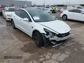 2021 Tesla Model 3 Long Range with VIN 5YJ3E1EB3MF059713, listed as a IAAI auction lot 41778289 with 52,211 mi miles. Bid and sale history available at carsss.com. Image 1.
