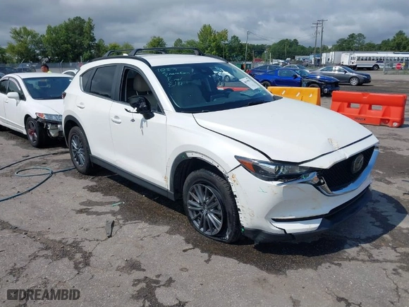 2019 Mazda CX-5 Touring with VIN JM3KFBCM3K0659167, listed as a IAAI auction lot 40199879 with NaN miles. Bid and sale history available at carsss.com. Image 1.