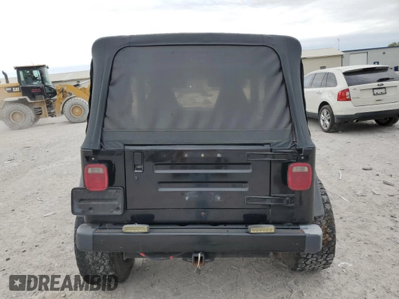 2000 Jeep Wrangler Sport with VIN 1J4FA49S9YP743515, listed as a Copart auction lot 53906305 with 247,349 mi miles and Salvage title. Bid and sale history available at DreamBid. Image 6.