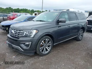 2021 Ford Expedition Max Limited z VIN 1FMJK2AT6MEA00611, wystawiony jako IAAI lot #42371665 z przebiegiem 66 789 mil mil oraz . Historia ofert i sprzedaży dostępna na DreamBid. Obrazek 2.