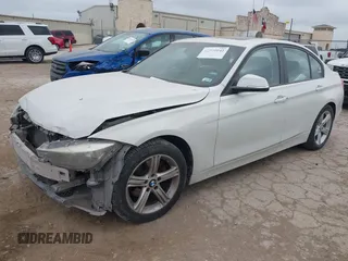 2014 BMW 3 Series 320i xDrive with VIN WBA3C3C52EP661389, listed as a IAAI auction lot 42160042 with 131,997 mi miles and . Bid and sale history available at DreamBid. Image 2.