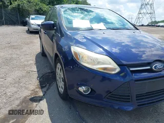 2012 Ford Focus SE z VIN 1FAHP3F22CL157417, wystawiony jako IAAI lot #42655527 z przebiegiem 107 472 mil mil oraz . Historia ofert i sprzedaży dostępna na DreamBid. Obrazek 6.