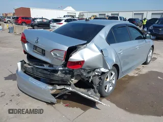 2014 Volkswagen Jetta TDI w/Premium with VIN 3VWLL7AJ6EM424935, listed as a IAAI auction lot 41533634 with 64,028 mi miles and . Bid and sale history available at DreamBid. Image 4.
