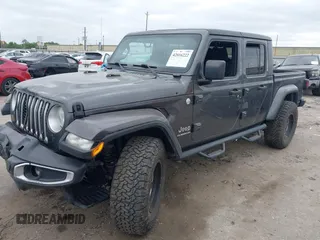 2020 Jeep Gladiator Overland with VIN 1C6HJTFG8LL166086, listed as a IAAI auction lot 42016222 with 102,232 mi miles and . Bid and sale history available at DreamBid. Image 2.