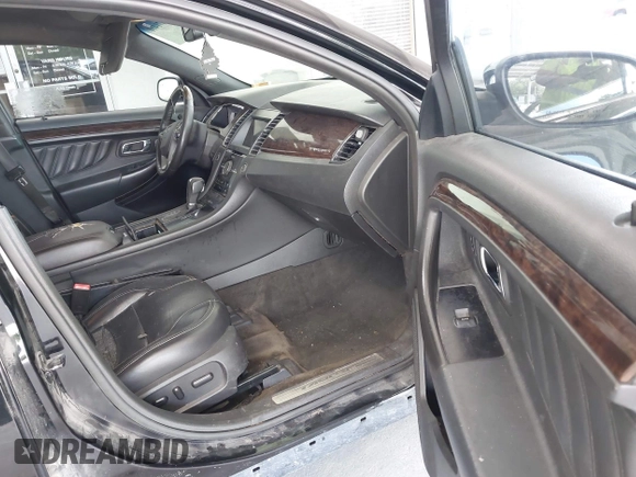 2017 Ford Taurus Limited z VIN 1FAHP2F81HG102598, wystawiony jako IAAI lot #42471410 z przebiegiem 165 386 mil mil oraz . Historia ofert i sprzedaży dostępna na DreamBid. Obrazek 5.