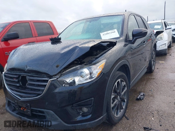 2016 Mazda CX-5 Grand Touring z VIN JM3KE4DY9G0605489, wystawiony jako IAAI lot #42085160 z przebiegiem 160 338 mil mil oraz . Historia ofert i sprzedaży dostępna na DreamBid. Obrazek 2.