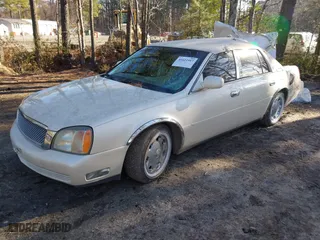 2002 Cadillac DeVille DHS with VIN 1G6KE57Y42U216449, listed as a IAAI auction lot 41611917 with 73,054 mi miles. Bid and sale history available at carsss.com. Image 2.