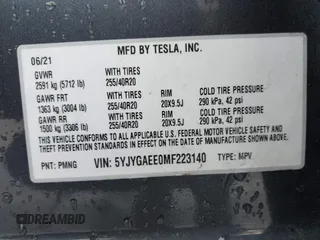 2021 Tesla Model Y Long Range with VIN 5YJYGAEE0MF223140, listed as a IAAI auction lot 42007701 with 55,308 mi miles. Bid and sale history available at carsss.com. Image 9.