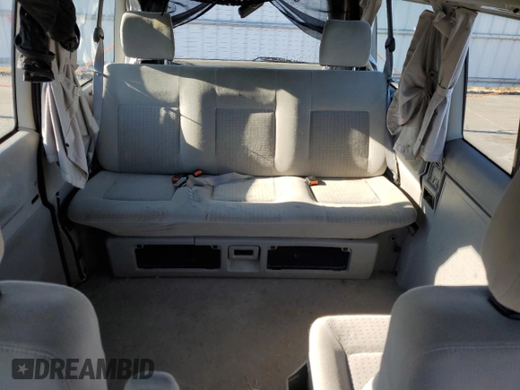 2003 Volkswagen EuroVan MV с VIN WV2NB47033H029173, выставлен на аукционе Copart как лот 82377584 с пробегом 231 083 миль миль и Чистый • Clean title. История ставок и продаж доступна на DreamBid. Изображение 10.