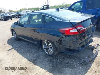 2018 Honda Clarity Touring z VIN JHMZC5F32JC001730, wystawiony jako IAAI lot #41718456 z przebiegiem 64 619 mil mil oraz . Historia ofert i sprzedaży dostępna na DreamBid. Obrazek 3.