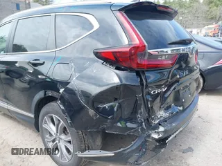 2020 Honda CR-V Touring with VIN 7FART6H96LE023782, listed as a IAAI auction lot 42053948 with 56,814 mi miles and . Bid and sale history available at DreamBid. Image 17.