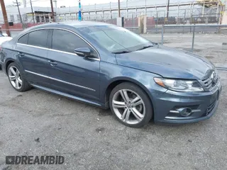 2013 Volkswagen CC Sport with VIN WVWBP7AN3DE571837, listed as a IAAI auction lot 41784447 with 156,834 mi miles. Bid and sale history available at carsss.com. Image 1.