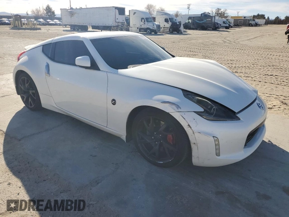 2014 Nissan 370Z Nismo with VIN JN1AZ4EH0EM635111, listed as a Copart auction lot 87292134 with 185,356 mi miles and Salvage Title. Bid and sale history available at DreamBid. Image 4.