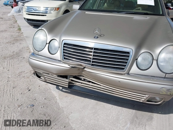1999 Mercedes-Benz E-Class with VIN WDBJH65F3XA845635, listed as a IAAI auction lot 42102122 with 215,678 mi miles. Bid and sale history available at carsss.com. Image 6.