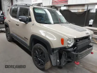 2017 Jeep Renegade Trailhawk z VIN ZACCJBCB6HPE92784, wystawiony jako IAAI lot #41423405 z przebiegiem 128 361 mil mil oraz . Historia ofert i sprzedaży dostępna na DreamBid. Obrazek 1.